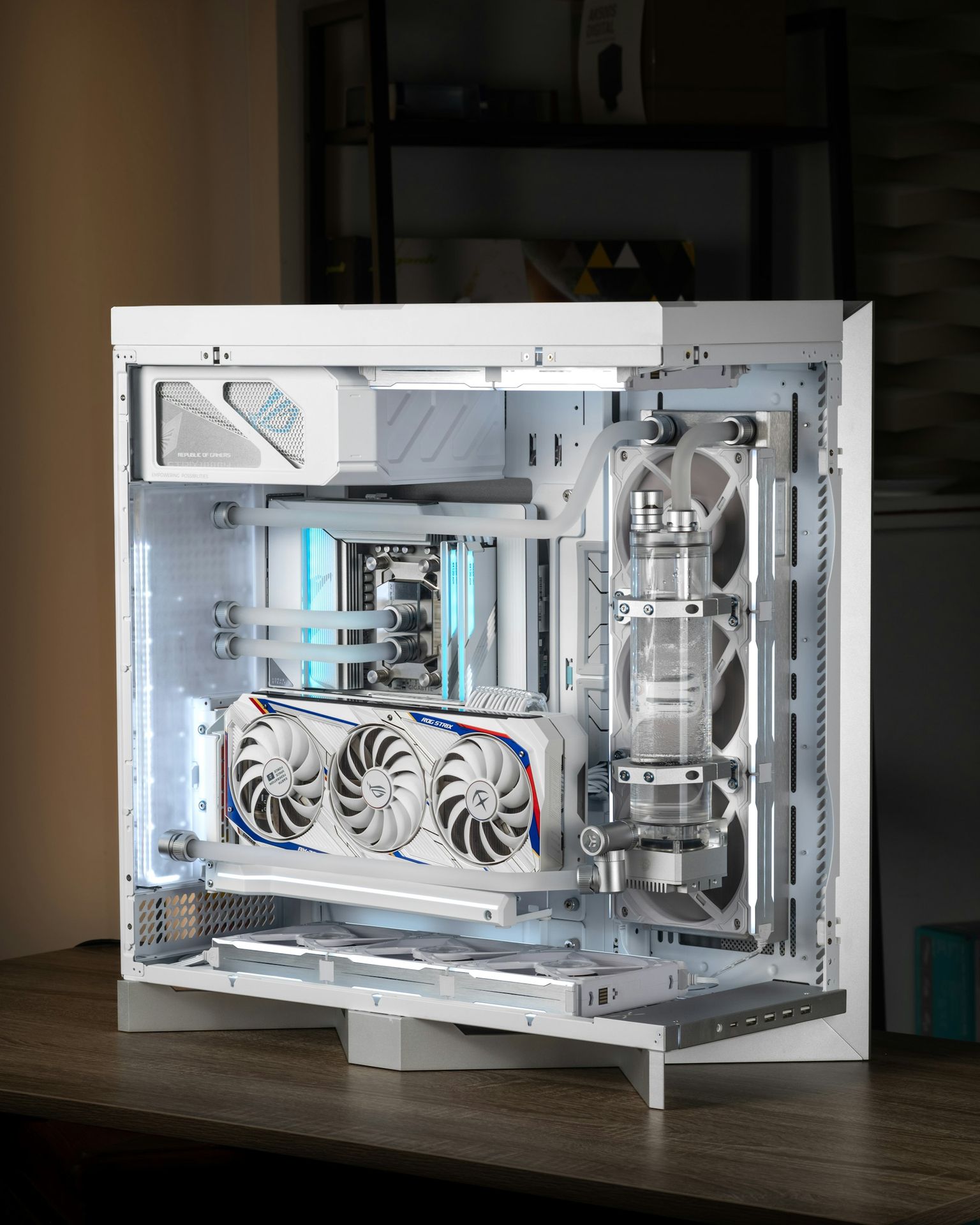 A sleek, custom PC build glows with blue light.